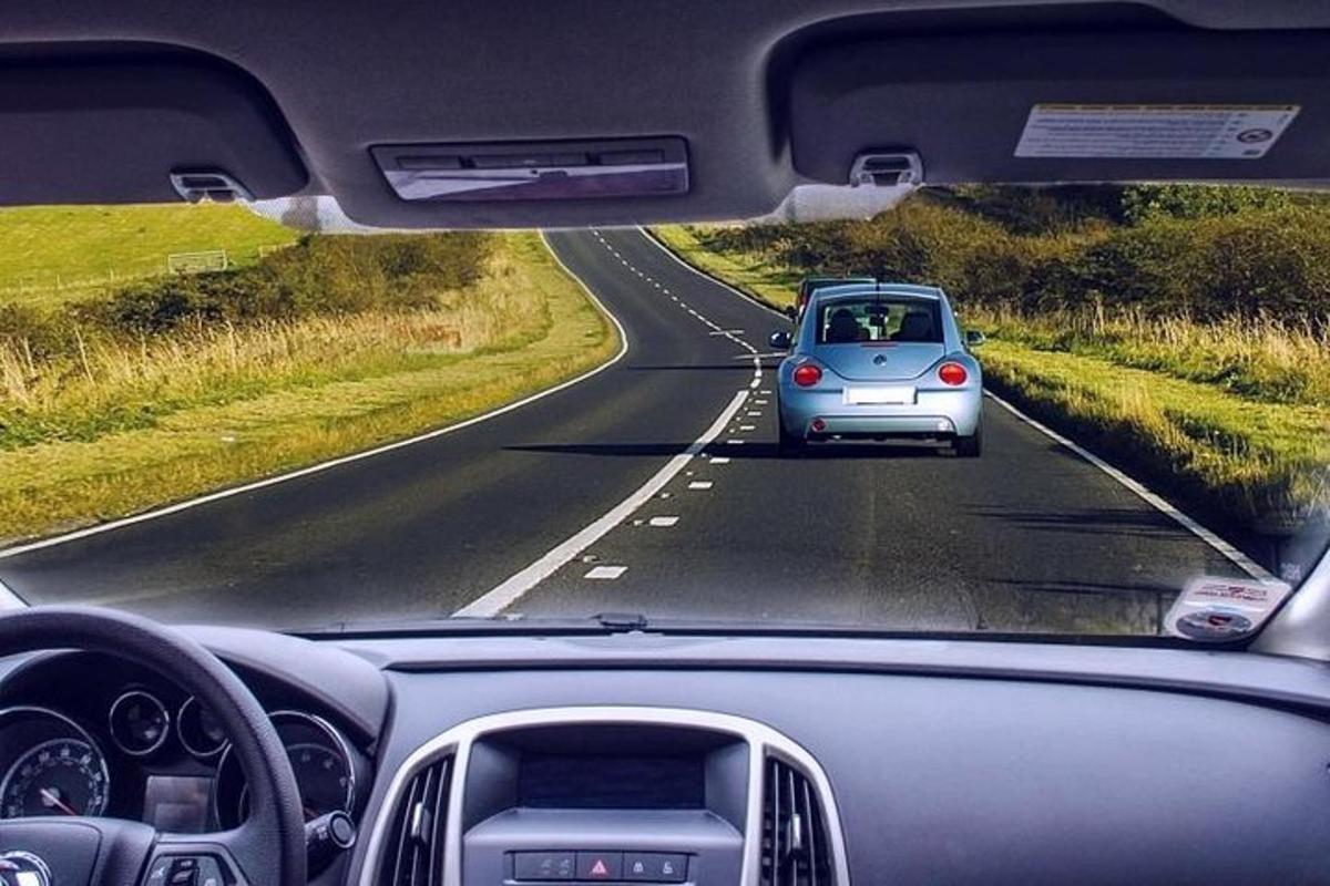 a car driving down a road with
