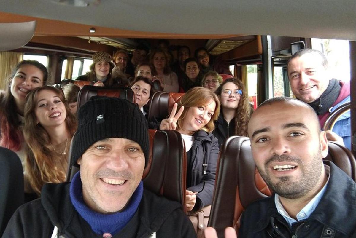 a group of people sitting on a bus