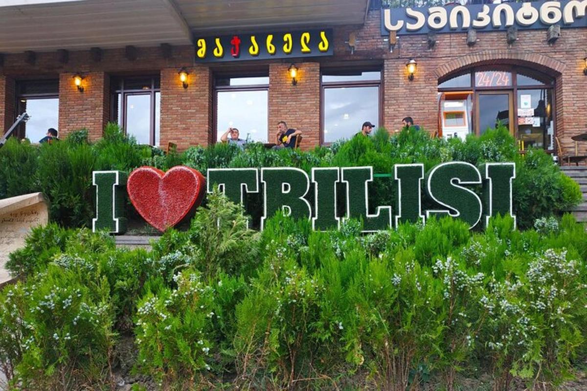 a sign that says i heart bush in front of a building