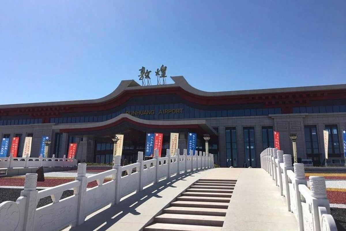 a building with a fence in front of a library