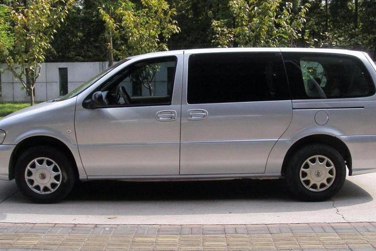 a silver van parked on the side of a street