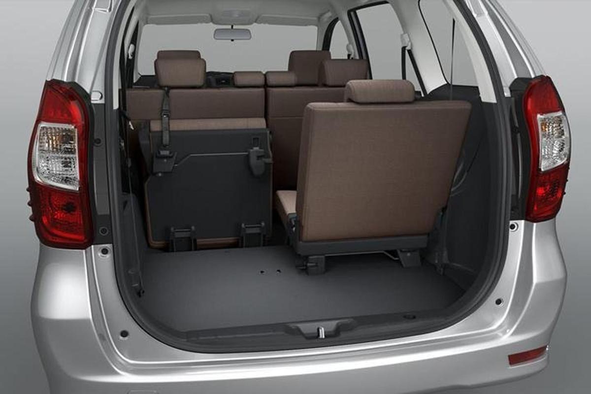 an open trunk of a car with the back door open