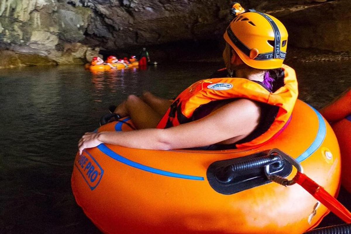 a woman is sitting in anlatable raft in the water