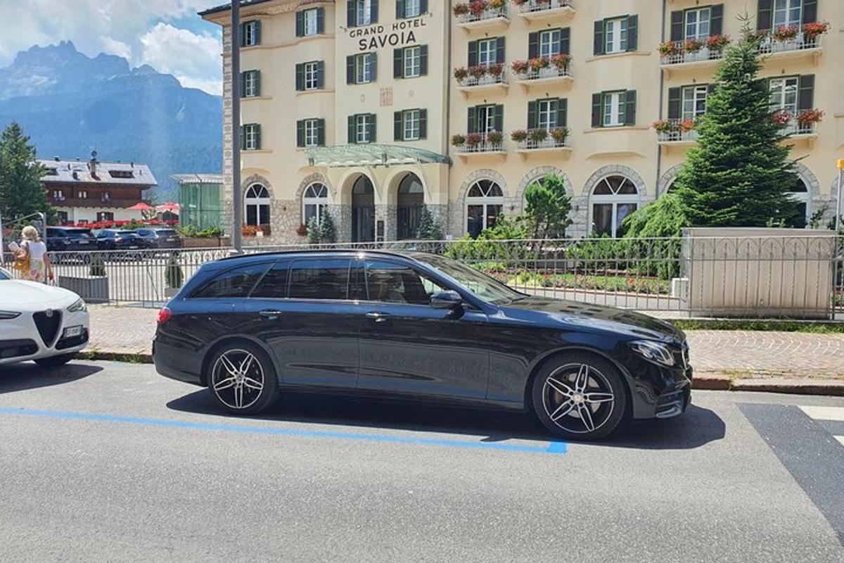 a black car parked in front of a building