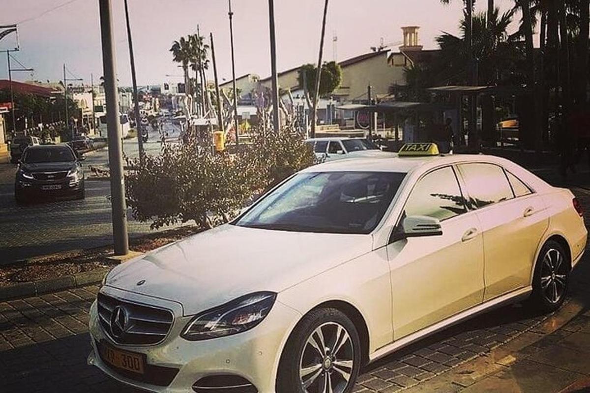 a white car parked on the side of a street