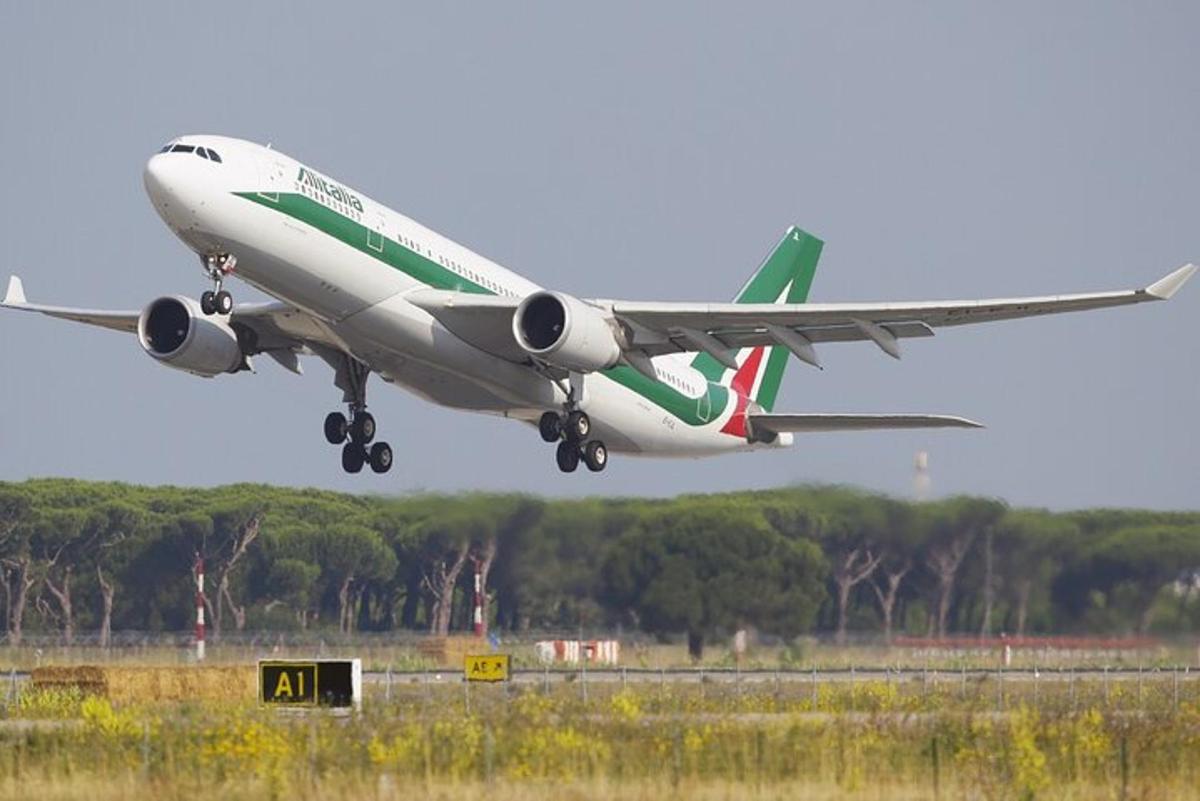 an airplane is taking off from an airport runway