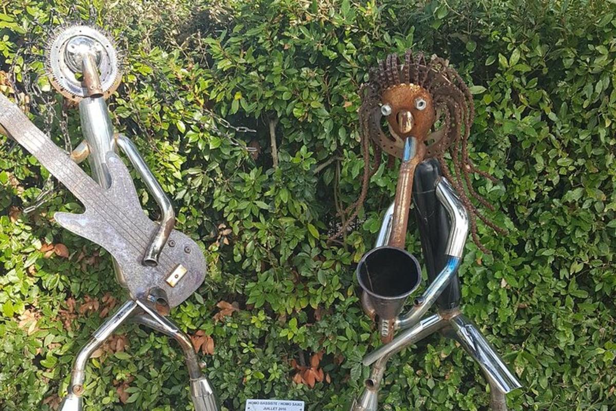 two pairs of golf clubs on a hedge
