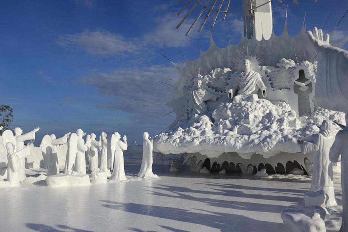 a group of statues of people in a snow sculpture