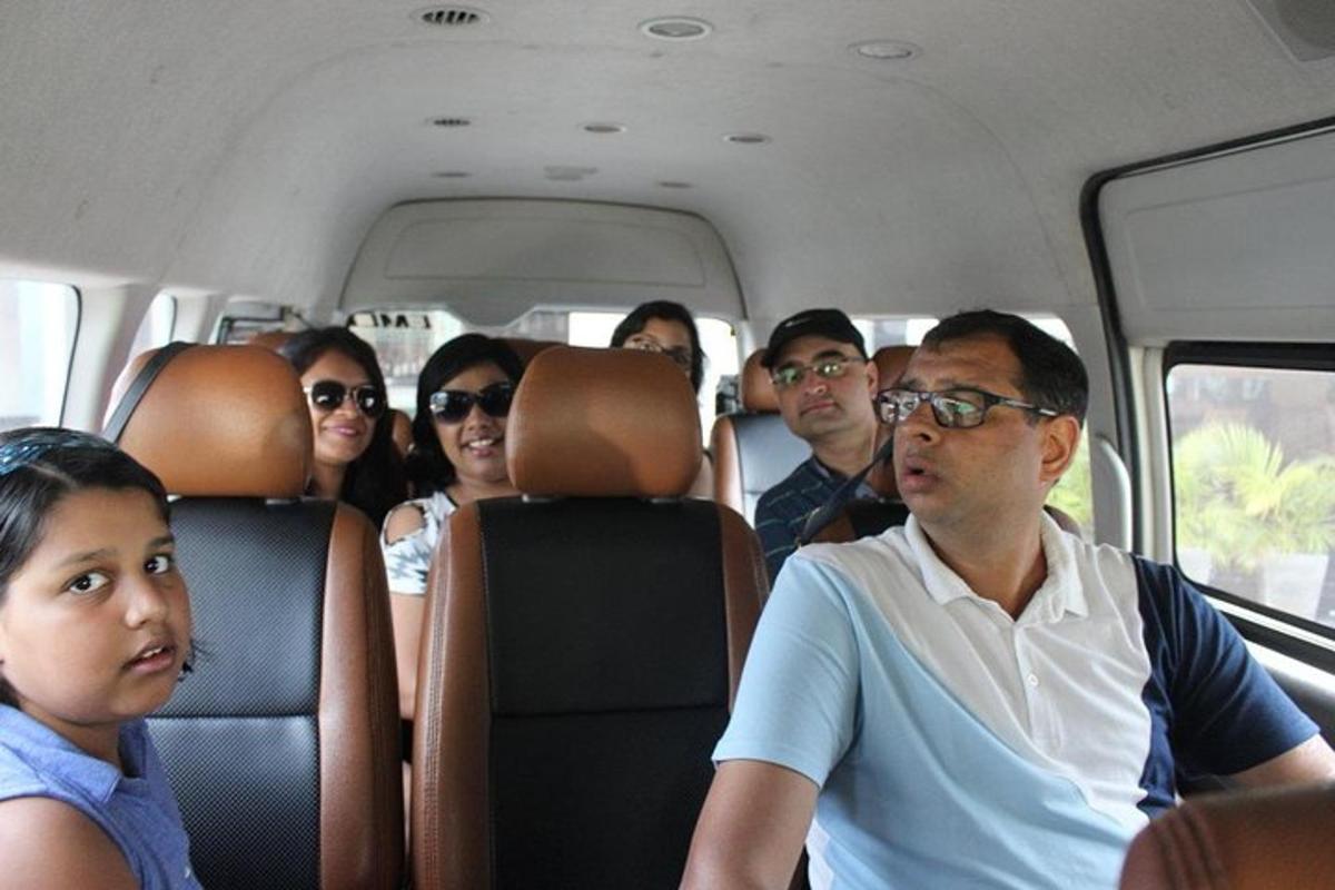 a group of people sitting in a bus