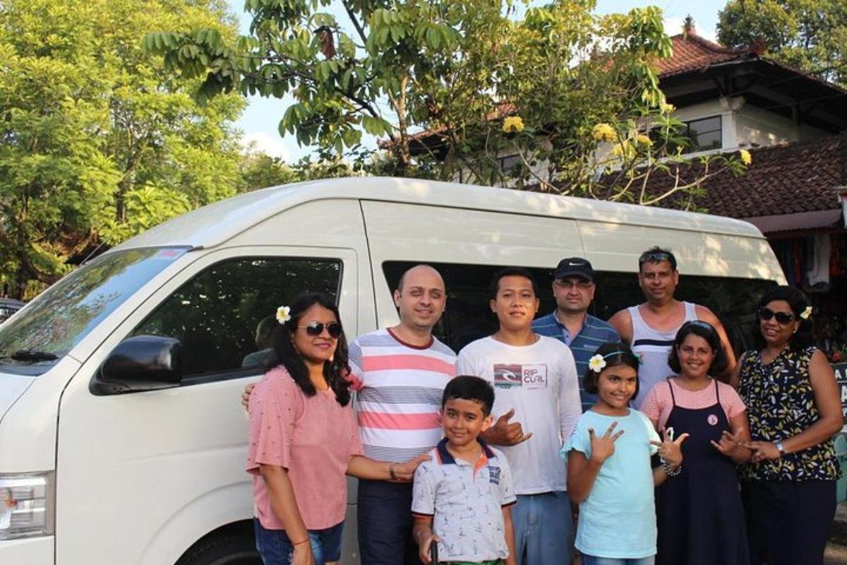 a group of people standing in front of a van