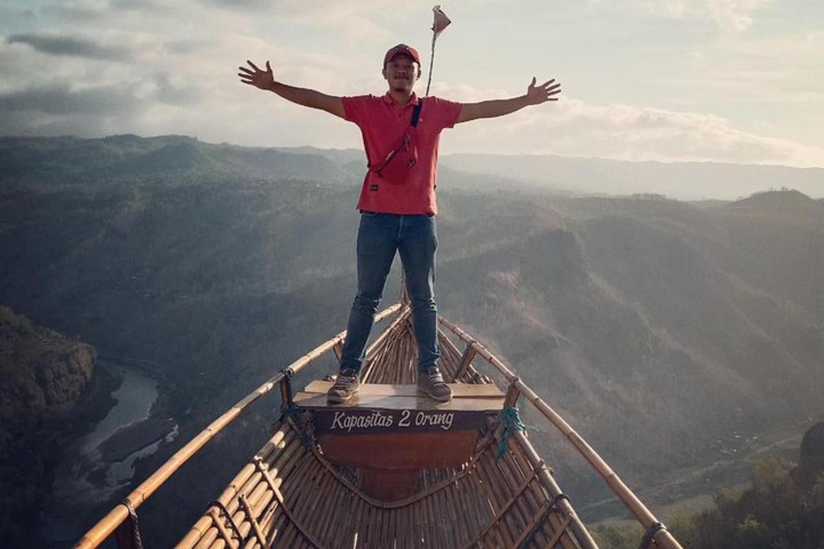 a man standing on the top of a lookout tower