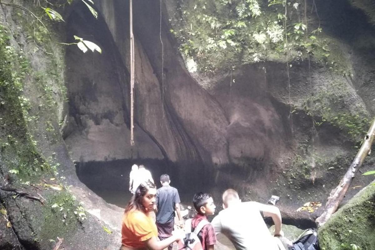 a group of people standing in front of a tunnel