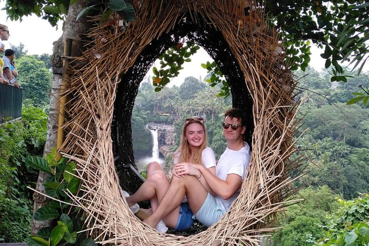 a man and a woman sitting in a nest