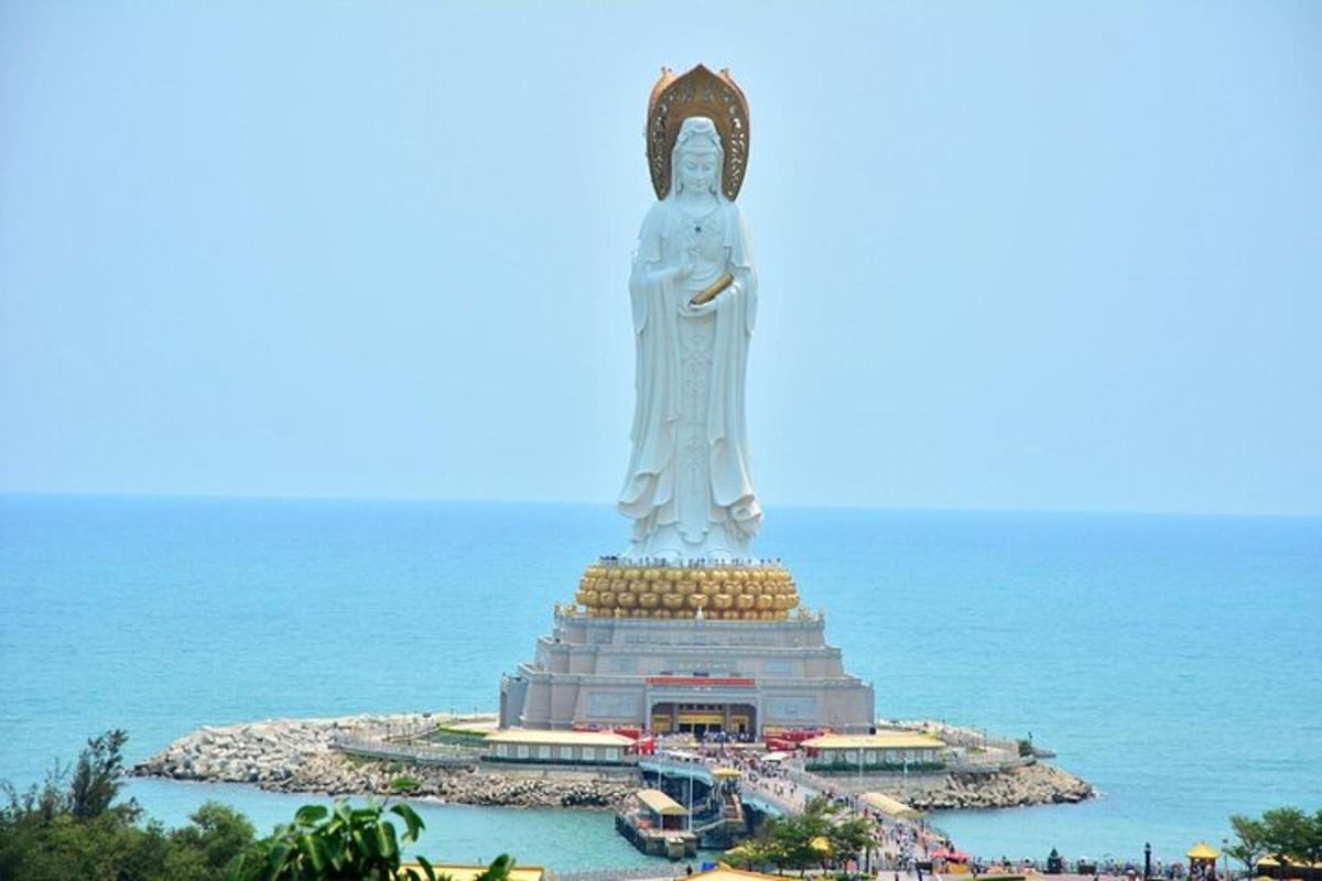 a large statue in the middle of the ocean