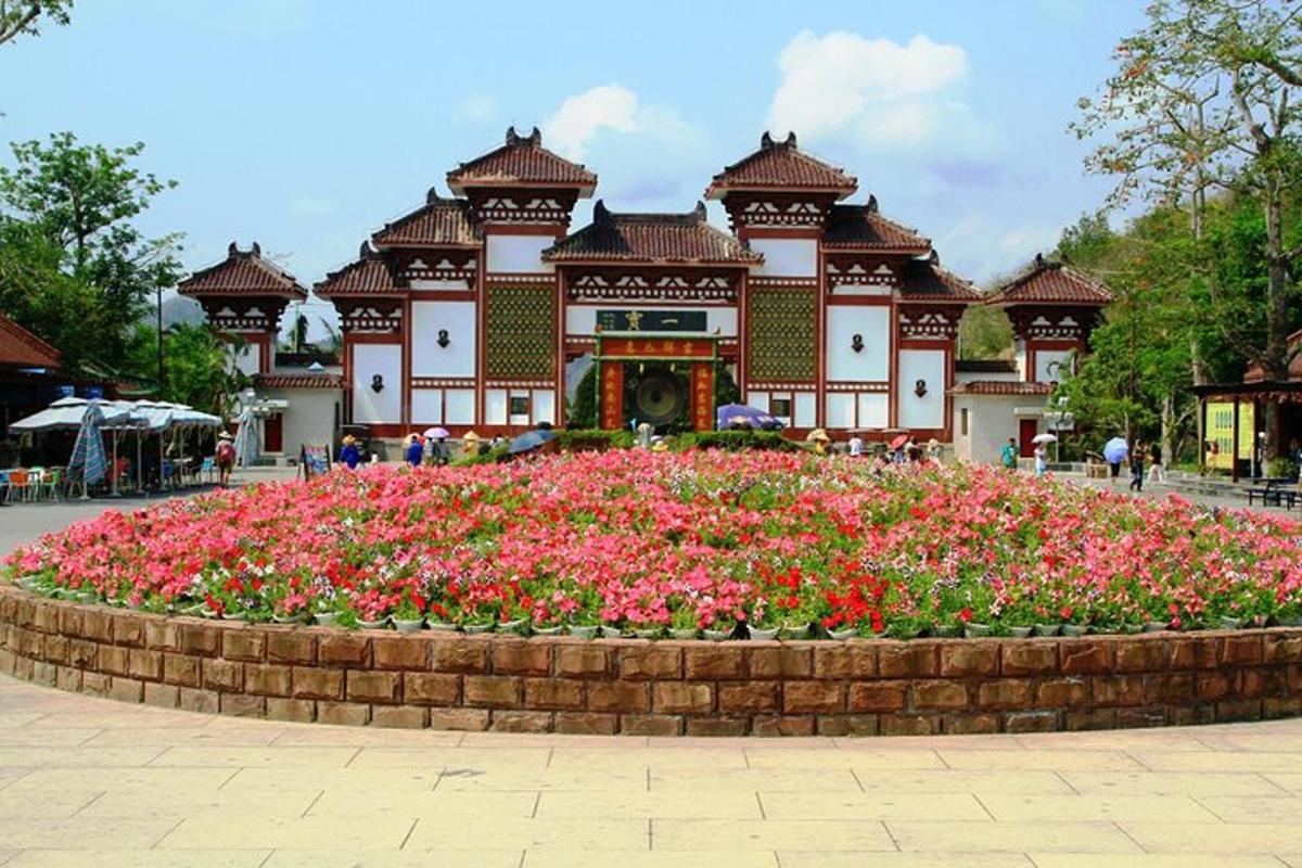 a building with a flower garden in front of it