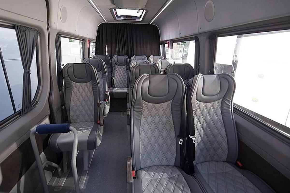 the inside of a bus with empty seats
