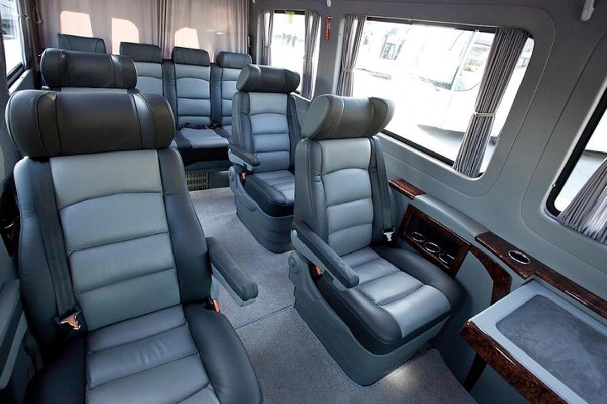 an empty train car with empty seats on a train