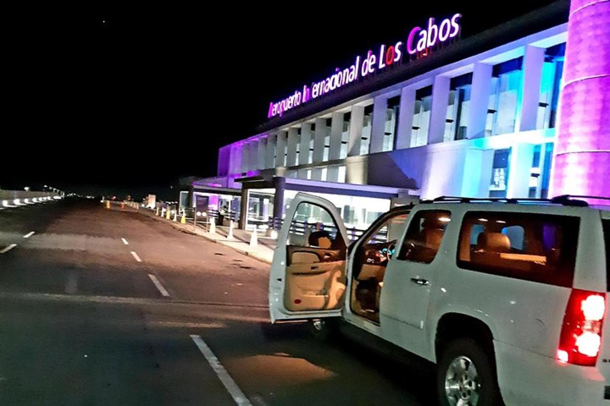 a white truck parked in front of a building