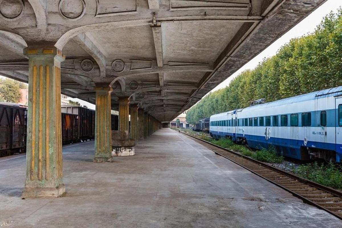 a train station with a train on the tracks