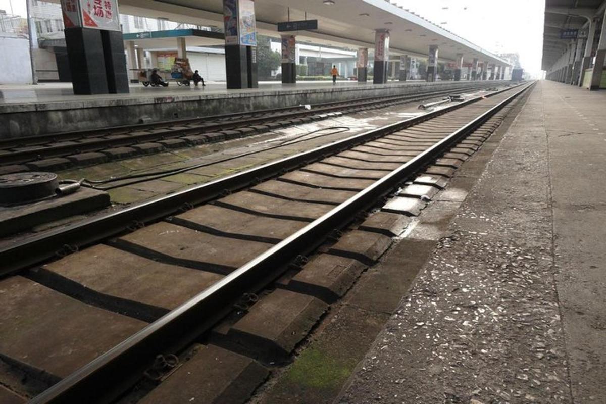 a row of train tracks in a train station