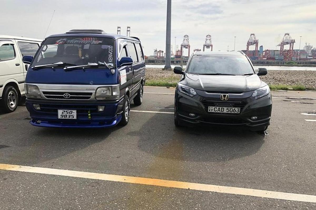 two cars parked next to each other in a parking lot