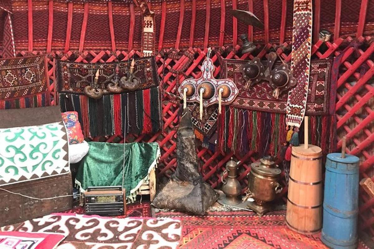 a room with a red wall with various items on it
