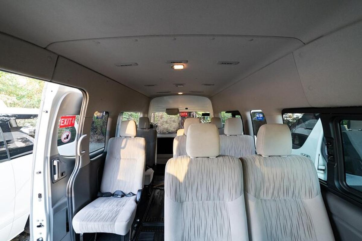 an inside view of a van with white seats