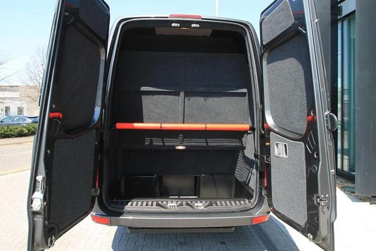 an open back door of a vehicle with the back door open