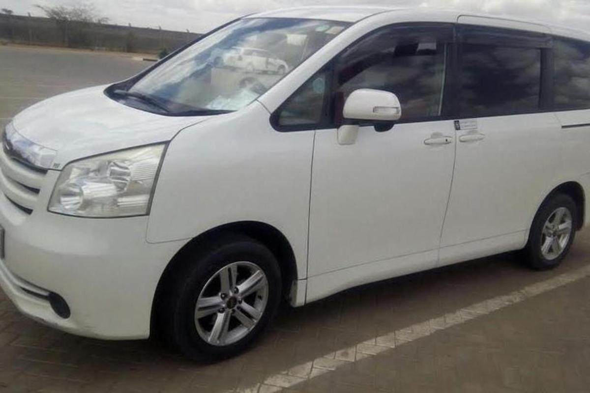a white van parked in a parking lot