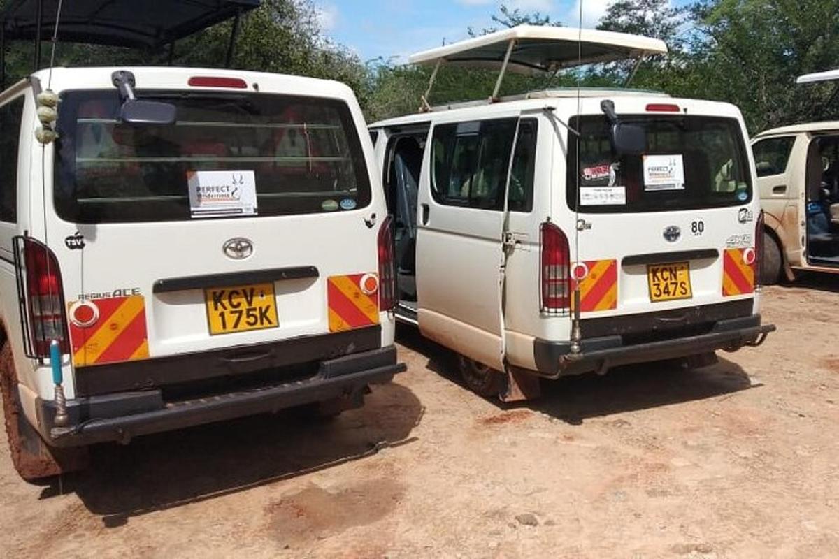two white vans parked next to each other