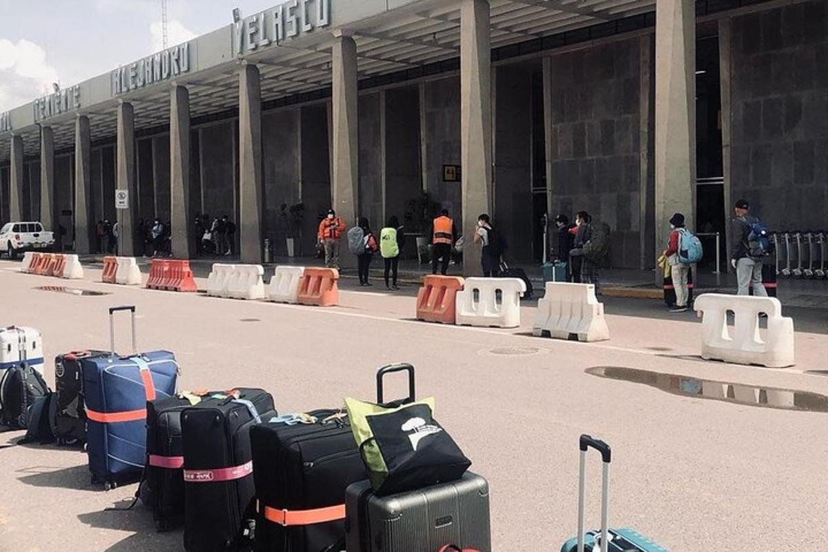 a bunch of luggage sitting in front of a building