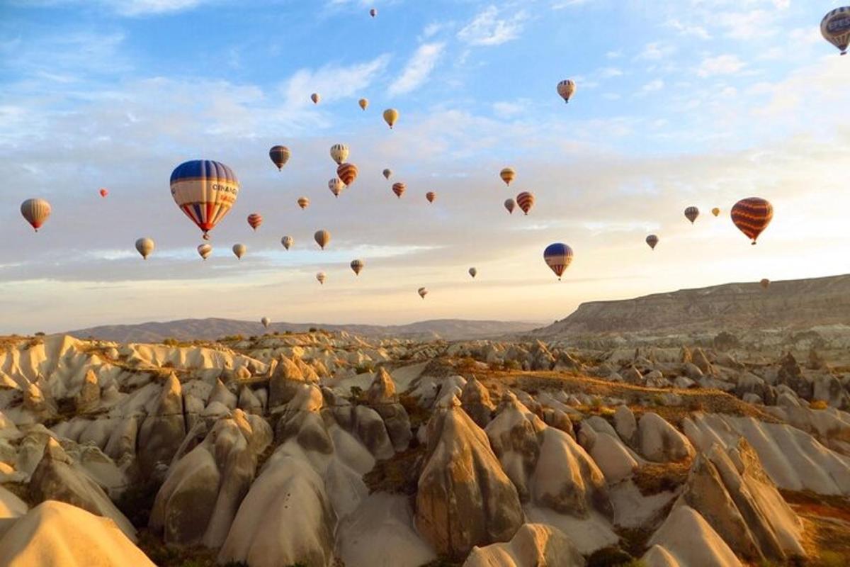 a group of hot air balloons flying in the sky