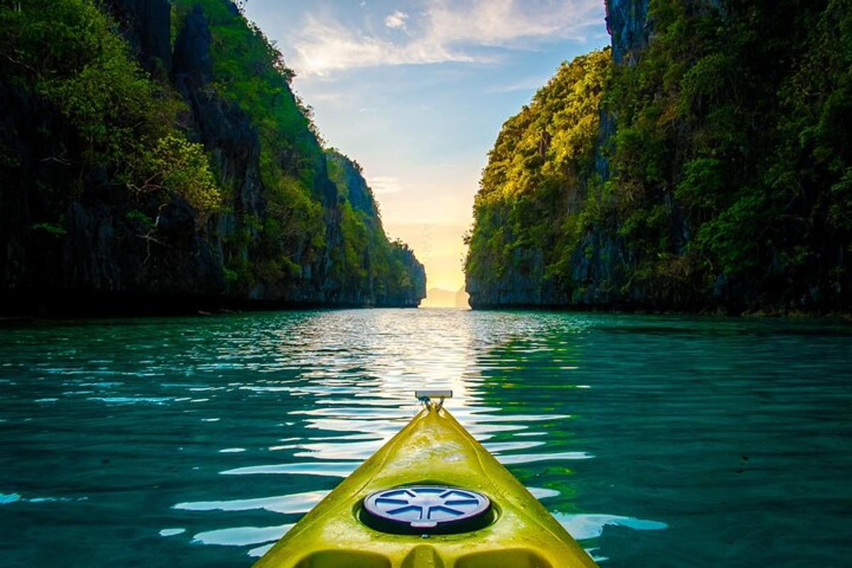 a yellow kayak in the middle of a river in a canyon
