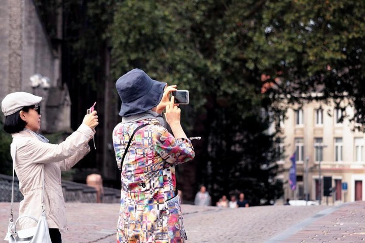 a woman taking a picture of another woman with a camera