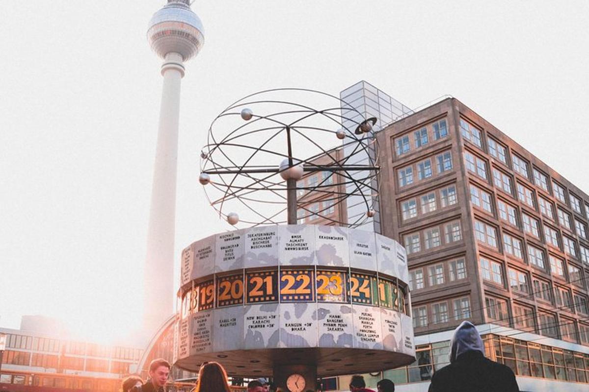 a ferris wheel in front of a building with a tower