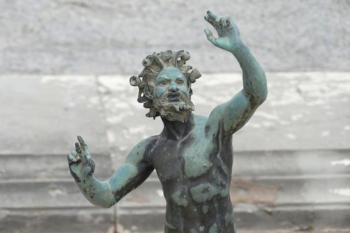 a statue of a woman with her hands in the air