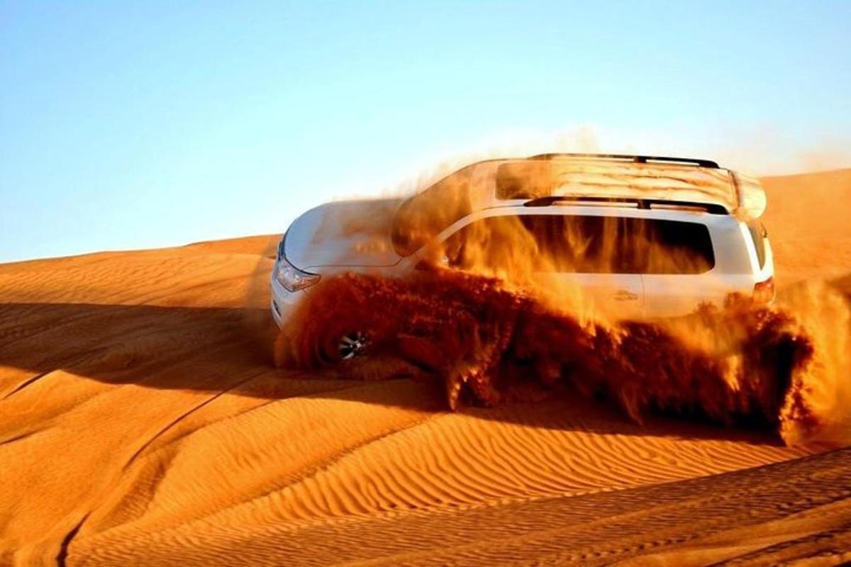 a car in the sand in the desert