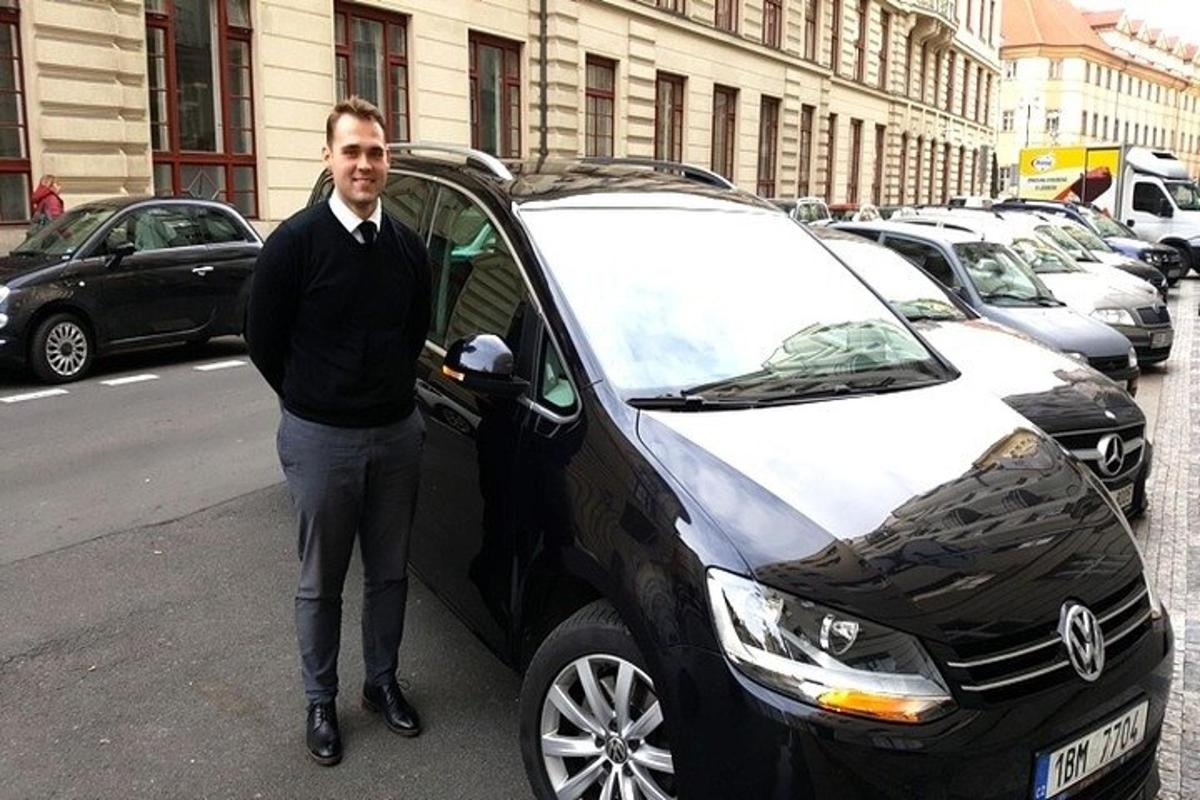 a man is standing next to a car