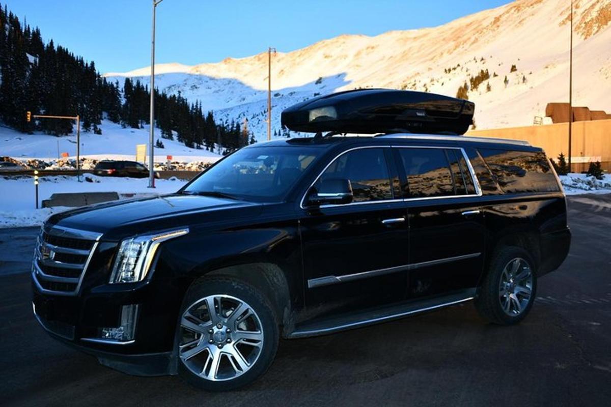 a black suv parked in a parking lot