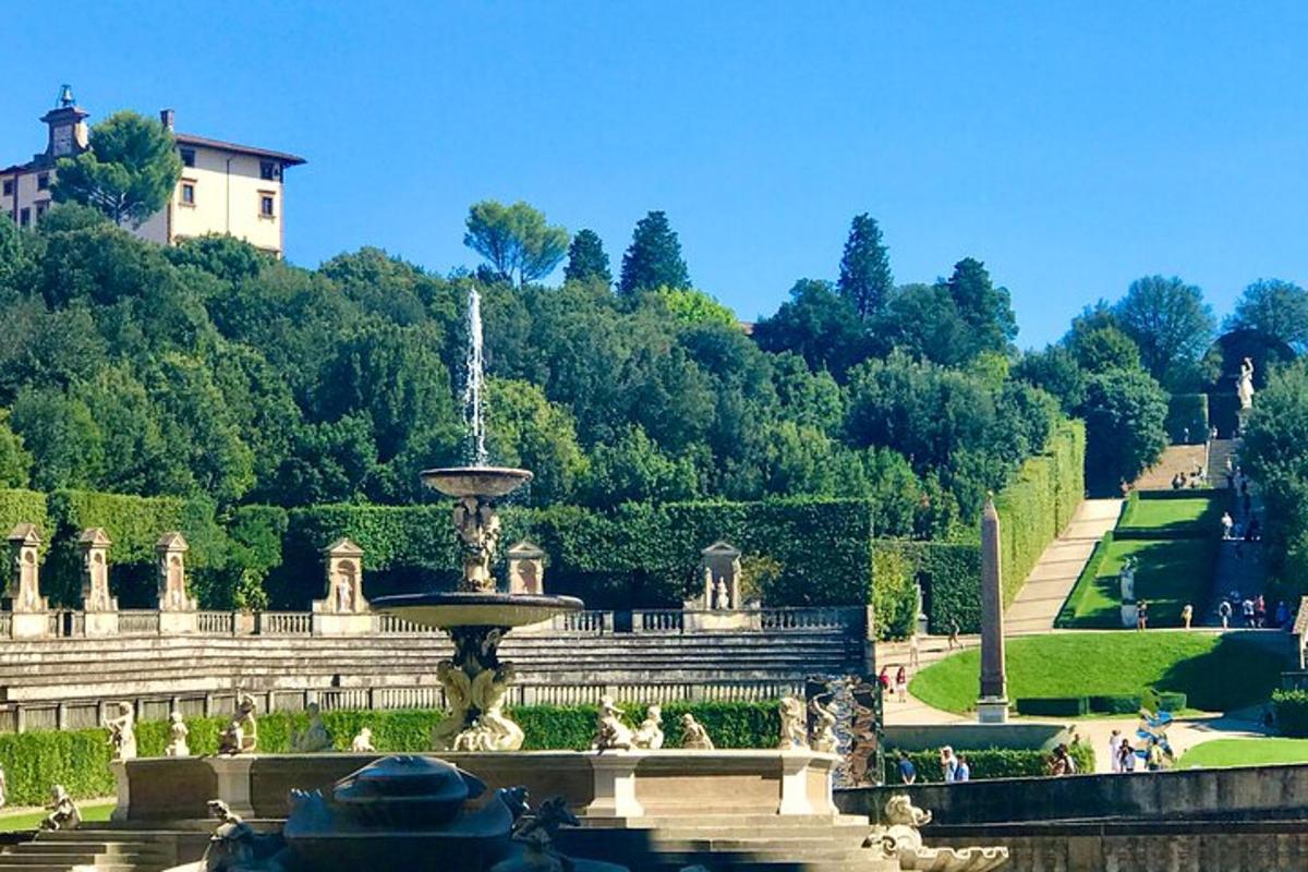 a fountain in the middle of a garden