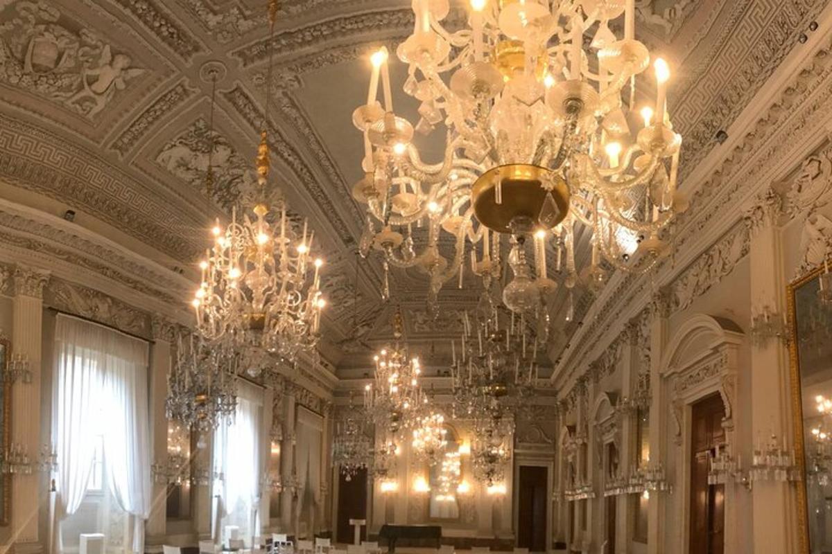 a large room with chandeliers hanging from the ceilings