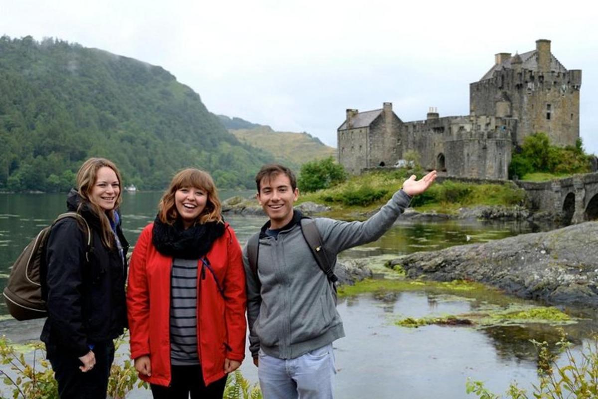 a group of people standing in front of a castle