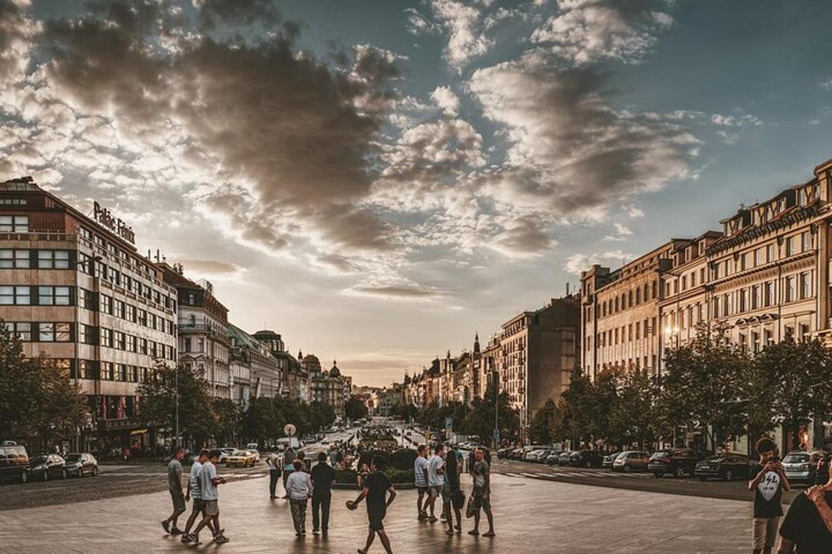 a group of people walking down a city street