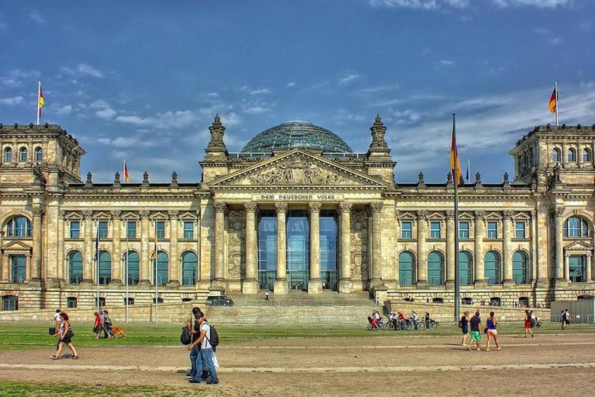 a large building with people standing in front of it