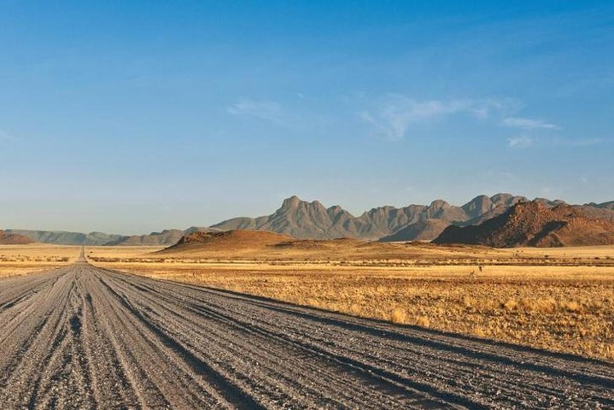 an empty road in the middle of the desert
