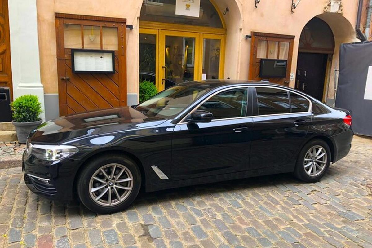 a black car parked in front of a building