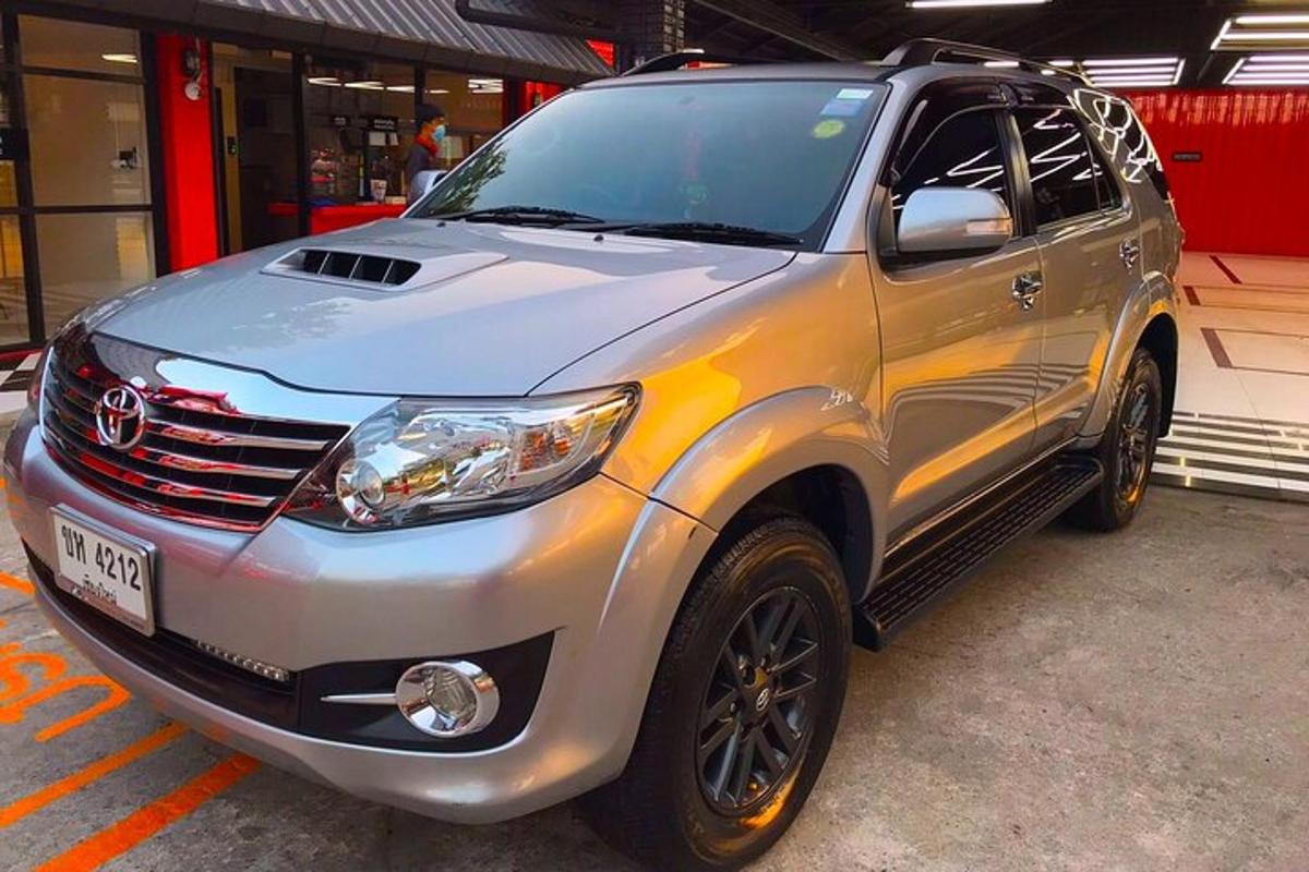 a silver suv parked in a parking lot