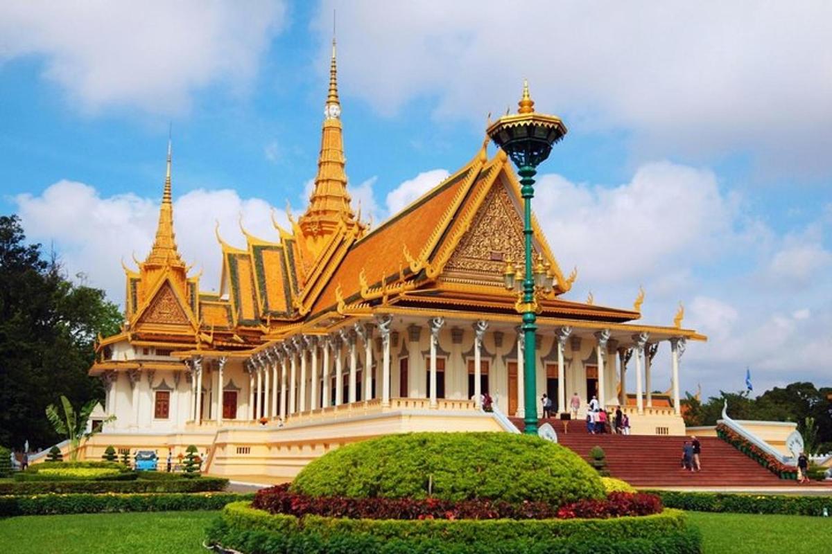 a large building with gold domes and a street light