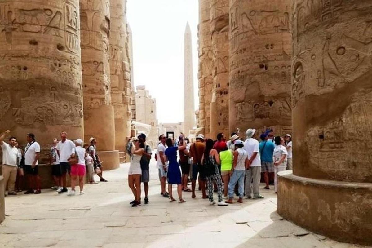 a group of people standing in the entrance to the temple