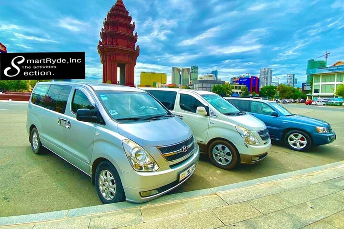 a group of three cars parked in a parking lot